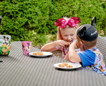 Kids eating chicken nuggets